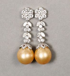 Pair of 18 Karat White Gold and Diamond Pierced Earrings, having seven round cut diamonds over two round cut diamonds, two marquis cut diamonds, along
