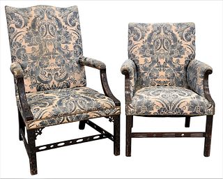 Two Mahogany Chippendale Upholstered Arm Chairs, each having pierced stretchers, one is 18th century probably English, one stretcher off. Provenan