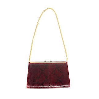 A selection of reptile skin handbags and wallets. To include two snakeskin bags, a plum coloured str