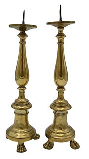 Pair of Early Brass Pricket Sticks, having paw feet, total height 16 inches.