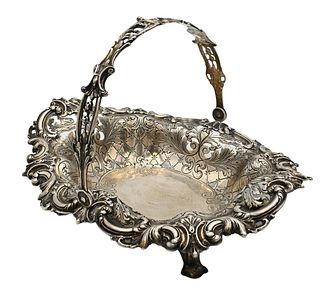 Tiffany & Company Sterling Silver Basket, having reticulated edge and handle, height 7 3/4 inches, length 10 3/4 inches, 22.5 t.oz. Provenance: An est