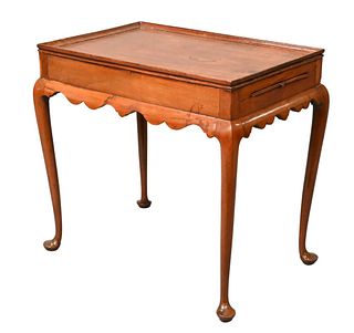 Queen Anne Mahogany Tea Table, having rectangle dished top, two candle slides over scalloped apron, all set on cabriole legs ending in pad feet, proba