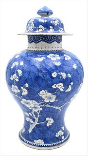 Chinese Blue and White Prunus Covered Temple Jar, 18th century, Kangxi period (1644 - 1722), decorated with white flowers on blue background, age crac