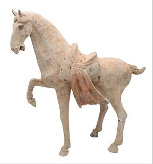 Tang Dynasty Horse Figure, having remnants of paint on plexiglass platform stand, (repairs), height 24 1/2 inches, length 23 inches, (repairs).