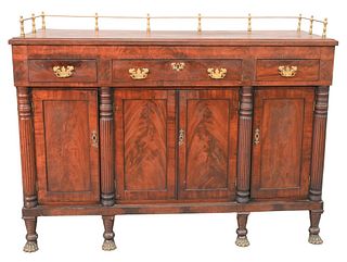 Classical Mahogany Sideboard, first half of 19th century, brass three-quarter galleried top above three drawers, over four paneled doors, raised on pa