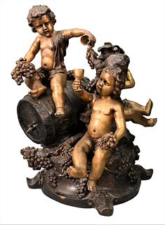 After Auguste Moreau Bronze Fountain, having three puttis sitting atop a wine barrel with grape vines and chalices, signed "A. Moreau" on base, height