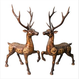 Pair of Chinese Bronze Deer or Stag, having bats, dragons, characters and phoenix birds, height 33 1/2 inches, length 22 inches.
