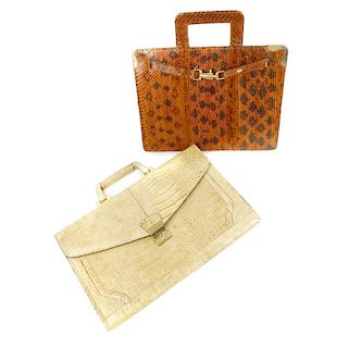 Two A4 reptile skin document cases. To include a brown snakeskin example with gold-tone hardware, re