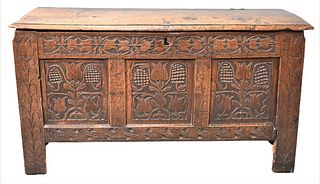 Oak Sunflower Chest, having lift top over carved three panel chest, each with sunflowers on square supports, original snipe hinges, circa 1700, height