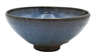 Chinese Ceramic Jun Ware Bowl, having blue glazed ground with purple splash on unglazed footed base, height 3 1/2 inches, diameter 7 1/4 inches.