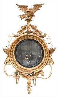 Fine Classical Carved Giltwood Girandole Mirror, Philadelphia, circa 1815, flat circular mirror plate, ebonized slip surround by a framework hung with