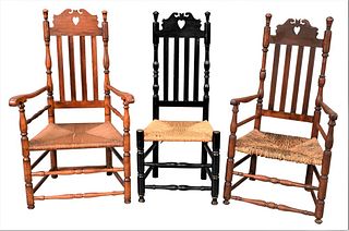 Three Heart and Crown Bannister Back Chairs, two having arms, one side, all with rush seats, 18th century, heights 44 - 45 inches.