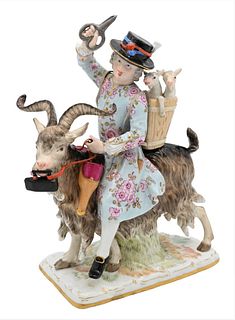 Meissen Porcelain Figure, "Count Bruhl's Tailor", modeled as a tailor riding a goat and holding a basket with a lamb; crossed blue sword mark on botto