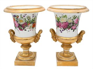 Pair of French Porcelain Urns, having painted wild flowers and gilt gold mask handles on square base, height 13 1/4 inches.