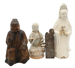 Four Piece Lot of Asian Figural Pieces, to include blanc de chine standing figure; a carved wood seated figure; stone seal with foo dog top; along wit