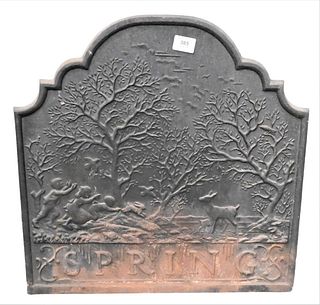 Iron Fire Back, having trees, people and deer, marked Spring, height 22 inches, width 21 1/2 inches.