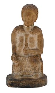 Early Carved Marble Figure, partially clad sitting in a chair holding an unknown object, repaired, height 9 inches.