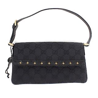 GUCCI - a small studded shoulder bag. Featuring a black canvas exterior with GG motif, thin leather