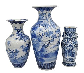 Three Blue and White Porcelain Vases, to include two Japanese with painted flowers; along with a Chinese hexagon vase with molded dragons and foo dogs