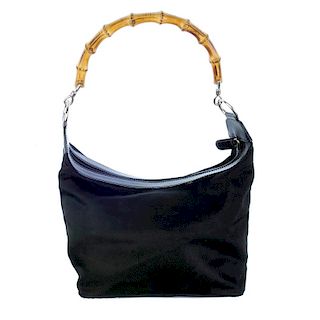 GUCCI - a nylon bamboo hobo. Designed with a black nylon exterior and patent leather trim, silver-to