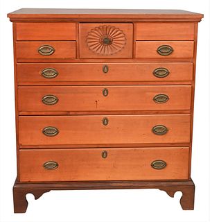 Chippendale Cherry Chest, having oval carving in top drawer, now on bracket base, height 43 inches, width 38 inches.