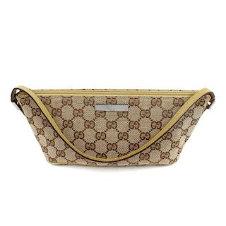 GUCCI - a small baguette shoulder bag. Featuring maker's classic GG patterned canvas exterior, thin