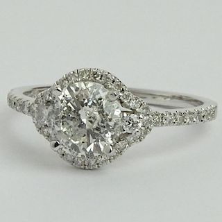 AIG Certified 1.04 Carat Round Brilliant Cut Diamond and 14 Karat White Gold Engagement Ring accented with .27 Carat Round Brilliant Cut Diamonds.