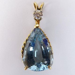Vintage Pear Shaped Blue Topaz, approx. .25 Carat Diamond  and 14 Karat Yellow Gold Pendant.