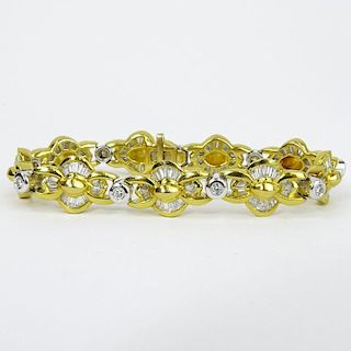 Lady's Approx. 4.50 Carat Tapered Baguette, .50 Carat Round Cut and 18 Karat Yellow and White Gold Bracelet.