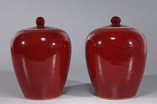 Pair of Chinese Porcelain Sang de Boeuf Covered Jars