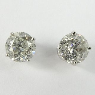 AIG Certified 3.17 Carat Total Weight Round Cut Diamond and 14 Karat White Gold Ear Studs.