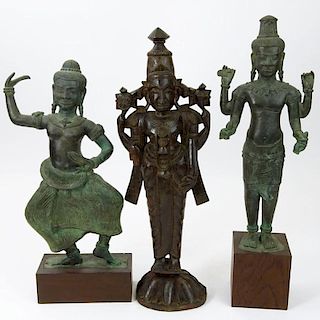 Pair of Modern Tibetan Style Cast Metal Figures on Wood Stands Together with a Carved Wood Figurine.