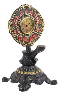 EARLY CAST IRON CIGAR CUTTER WITH CLOCK.
