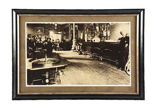 FRAMED AND MATTED CARDBOARD LITHOGRAPH OF THE COSMOPOLITAN SALOON, TELLURIDE, COLORADO.