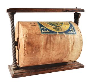 ORIGINAL COUNTRY STORE PAPER DISPENSER WITH FULL UNUSED ROLL OF CRAFT PAPER.