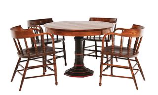 ROUND OAK POKER TABLE WITH FOUR CHAIRS AND CAST IRON BASE MARKED FOR THE BRUNSWICK-BALKE COLLENDER CO.