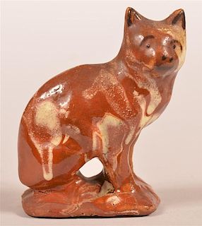 Mottle Glazed Redware Pottery of a Seated Cat.