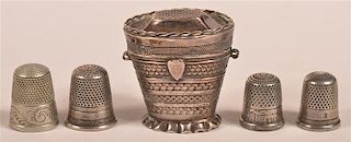Silver Thimble Case and Four Various Thimbles.