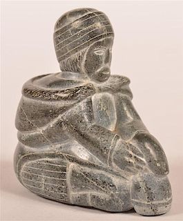 Eskimo Stone Carving of a Parka Clad Figure.