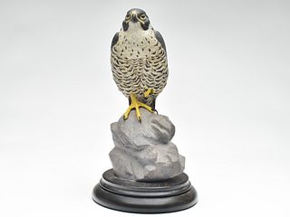 Full size carving of a falcon on a rock, Ron Tepley.