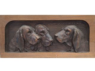 Impressive relief carved wooden panel of three hounds.