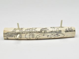 Eskimo scrimshaw walrus tusk cribbage board.