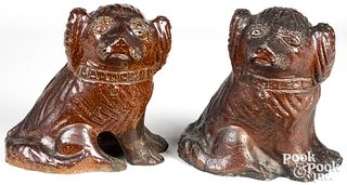 Two similar sewer tile spaniels, ca. 1900