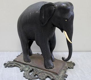 Finely Carved Ebony Elephant on Gilt Metal Base.