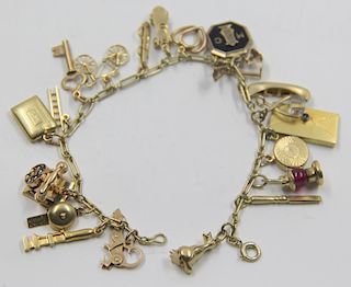 JEWELRY. Interesting 14kt Gold Charm Bracelet.