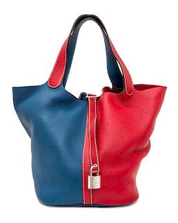 An Hermes Rouge Casaque and Bleu Taurillon Clemence Picotin Lock GM Handbag, 10.5" x 10.5" x 8.5".