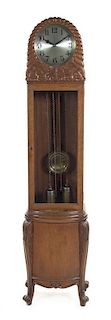 A German Art Deco Oak Tall Case Clock, Height 74 3/8 x width 17 1/2 inches.