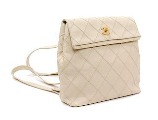 A Chanel Cream Caviar Leather Quilted Backpack, 12"x 10" x 3".