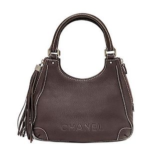 A Chanel Light Brown Caviar Leather Handbag, 12" x 8" x 5".