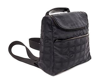 A Chanel Black Neoprene Cross Body Bag, 11" x 9.5" X 4".